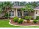 Beautiful home exterior with well-kept landscaping and a welcoming front entrance at 1254 Royal Pointe Ln, Ormond Beach, FL 32174