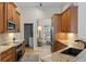 Open kitchen with modern appliances and granite countertops offers a breakfast nook view at 1254 Royal Pointe Ln, Ormond Beach, FL 32174