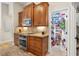 Kitchen with wooden cabinets, stainless steel appliances, and walk in pantry at 1254 Royal Pointe Ln, Ormond Beach, FL 32174