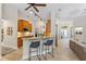 Open concept kitchen with breakfast bar and stainless steel appliances at 1254 Royal Pointe Ln, Ormond Beach, FL 32174