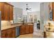Open kitchen with modern appliances and granite countertops offers a breakfast nook at 1254 Royal Pointe Ln, Ormond Beach, FL 32174