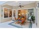Inviting lanai with a dining table set and views into the living room and kitchen at 1254 Royal Pointe Ln, Ormond Beach, FL 32174