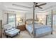Bright and airy primary suite with tray ceiling, ceiling fan, and elegant furnishings at 1254 Royal Pointe Ln, Ormond Beach, FL 32174