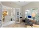 Comfortable home office with a desk, chair, and French doors for added privacy and style at 1254 Royal Pointe Ln, Ormond Beach, FL 32174