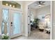Comfortable office space featuring a desk, comfortable chairs, and natural light from the windows at 1254 Royal Pointe Ln, Ormond Beach, FL 32174