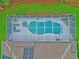 Aerial view of a screened-in pool and spa, integrated with the home's outdoor living space at 1254 Royal Pointe Ln, Ormond Beach, FL 32174
