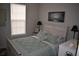 Bright bedroom with coastal decor, a whitewashed bed frame, and a serene atmosphere at 146 Via Madrid Dr, Ormond Beach, FL 32176