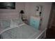 Comfortable guest bedroom featuring a queen bed and coordinated beach-themed decor at 146 Via Madrid Dr, Ormond Beach, FL 32176