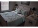 Bedroom featuring a cozy bed, natural light, and bedside tables with lamps at 146 Via Madrid Dr, Ormond Beach, FL 32176