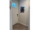 Inviting entryway featuring stylish wood-look flooring and a charming nautical themed decor at 146 Via Madrid Dr, Ormond Beach, FL 32176