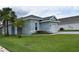 Charming single story home with well-manicured lawn, landscaping, and attached garage at 146 Via Madrid Dr, Ormond Beach, FL 32176
