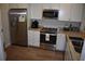 Bright kitchen with stainless steel appliances, granite countertops, and modern white cabinetry at 146 Via Madrid Dr, Ormond Beach, FL 32176