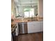 Elegant kitchen featuring stainless steel appliances, granite countertops, and open layout at 146 Via Madrid Dr, Ormond Beach, FL 32176
