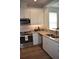 Lovely kitchen featuring stainless steel appliances, granite countertops, and ample cabinet space at 146 Via Madrid Dr, Ormond Beach, FL 32176