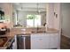 Stylish kitchen with stainless steel dishwasher, sink, and granite countertop overlooking the dining area at 146 Via Madrid Dr, Ormond Beach, FL 32176