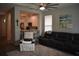 Open concept living room flowing into the kitchen with bar stool seating at 146 Via Madrid Dr, Ormond Beach, FL 32176