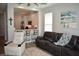 Living room with open concept kitchen and bar seating area at 146 Via Madrid Dr, Ormond Beach, FL 32176