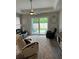 Bright, cozy living room with access to the outdoor patio and a large area rug at 146 Via Madrid Dr, Ormond Beach, FL 32176