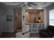 Open concept living area with seating, modern ceiling fan, and view of the kitchen bar at 146 Via Madrid Dr, Ormond Beach, FL 32176
