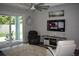 Comfortable living room with a TV and backyard views from sliding glass doors at 146 Via Madrid Dr, Ormond Beach, FL 32176