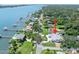Aerial view showcasing a waterfront home with lush landscaping and a tranquil pool at 1650 Riverside Dr, Daytona Beach, FL 32117