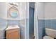 This bathroom features a wood vanity, a mirror, and a toilet next to the shower at 1650 Riverside Dr, Daytona Beach, FL 32117