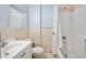 Standard bathroom with a shower-tub combo, light beige tile, and single sink at 1650 Riverside Dr, Daytona Beach, FL 32117