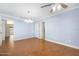 Bedroom with wood-patterned floors, light fixtures, and white trim at 1650 Riverside Dr, Daytona Beach, FL 32117