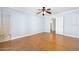 Bedroom featuring herringbone wood floors, ceiling fan, base molding, and walk-in closet at 1650 Riverside Dr, Daytona Beach, FL 32117