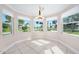 Sunlit dining area with large windows, neutral paint, and views of the outdoors at 1650 Riverside Dr, Daytona Beach, FL 32117