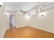 Large flex room with herringbone floors, neutral walls, and modern lighting at 1650 Riverside Dr, Daytona Beach, FL 32117