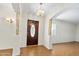 Elegant foyer with hardwood floors, decorative columns, and a stylish front door at 1650 Riverside Dr, Daytona Beach, FL 32117