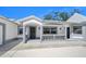 Charming home with a covered front porch, showcasing curb appeal and inviting entry at 1650 Riverside Dr, Daytona Beach, FL 32117
