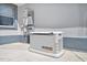 A modern Generac generator sits next to a window and against a gray wall at 1650 Riverside Dr, Daytona Beach, FL 32117