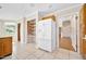 Bright kitchen area with stainless refrigerator and convenient access to other rooms at 1650 Riverside Dr, Daytona Beach, FL 32117