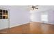 Open living area with wood herringbone floors, door to outside, and a ceiling fan at 1650 Riverside Dr, Daytona Beach, FL 32117