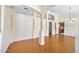Spacious living room featuring elegant columns, hardwood floors, and an open floor plan at 1650 Riverside Dr, Daytona Beach, FL 32117