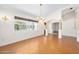 Spacious living room featuring hardwood floors, natural light, and decorative columns at 1650 Riverside Dr, Daytona Beach, FL 32117