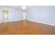Large, bright main bedroom with herringbone floors and an ensuite bathroom at 1650 Riverside Dr, Daytona Beach, FL 32117