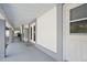 Covered patio with tile flooring, neutral paint, and a white door perfect for entertaining or enjoying the outdoors at 1650 Riverside Dr, Daytona Beach, FL 32117