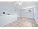 This room features tile floors, light blue walls, and a window with natural light at 1650 Riverside Dr, Daytona Beach, FL 32117