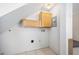 This room features upper cabinets for storage, white walls, and tile flooring at 1650 Riverside Dr, Daytona Beach, FL 32117