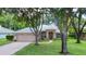 Charming single-story home with a well-manicured lawn and mature trees in a peaceful neighborhood at 24 Katrinas Dr, Ormond Beach, FL 32174