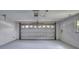 Spacious garage with an automatic door and side window at 24 Katrinas Dr, Ormond Beach, FL 32174