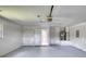 Clean, bright garage featuring a storage closet and a side door at 24 Katrinas Dr, Ormond Beach, FL 32174