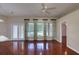 Bright living room with hardwood floors, ceiling fan and backyard view at 24 Katrinas Dr, Ormond Beach, FL 32174