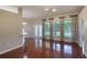 Bright living room with hardwood floors and french doors to the backyard at 24 Katrinas Dr, Ormond Beach, FL 32174