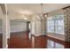 Bright living room features decorative lighting fixtures and windows with wood flooring at 24 Katrinas Dr, Ormond Beach, FL 32174