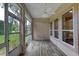 Sunroom with tile floors, ceiling fan, and many windows for bright sunlight at 24 Katrinas Dr, Ormond Beach, FL 32174