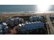 Aerial view of colorful beachfront townhomes and the surrounding community near the ocean at 3000 Ocean Shore Blvd # 18, Ormond Beach, FL 32176
